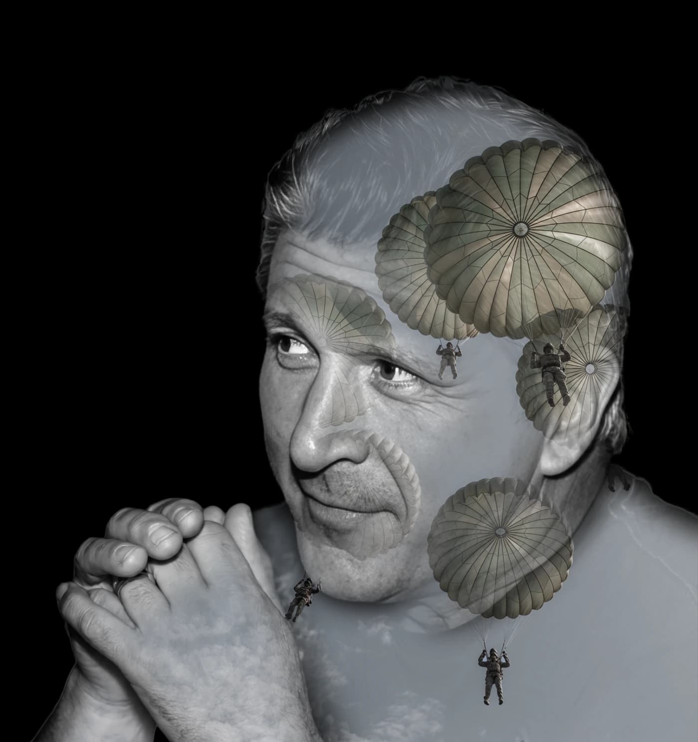 Double-exposure portrait of Kevin Popke with parachutists